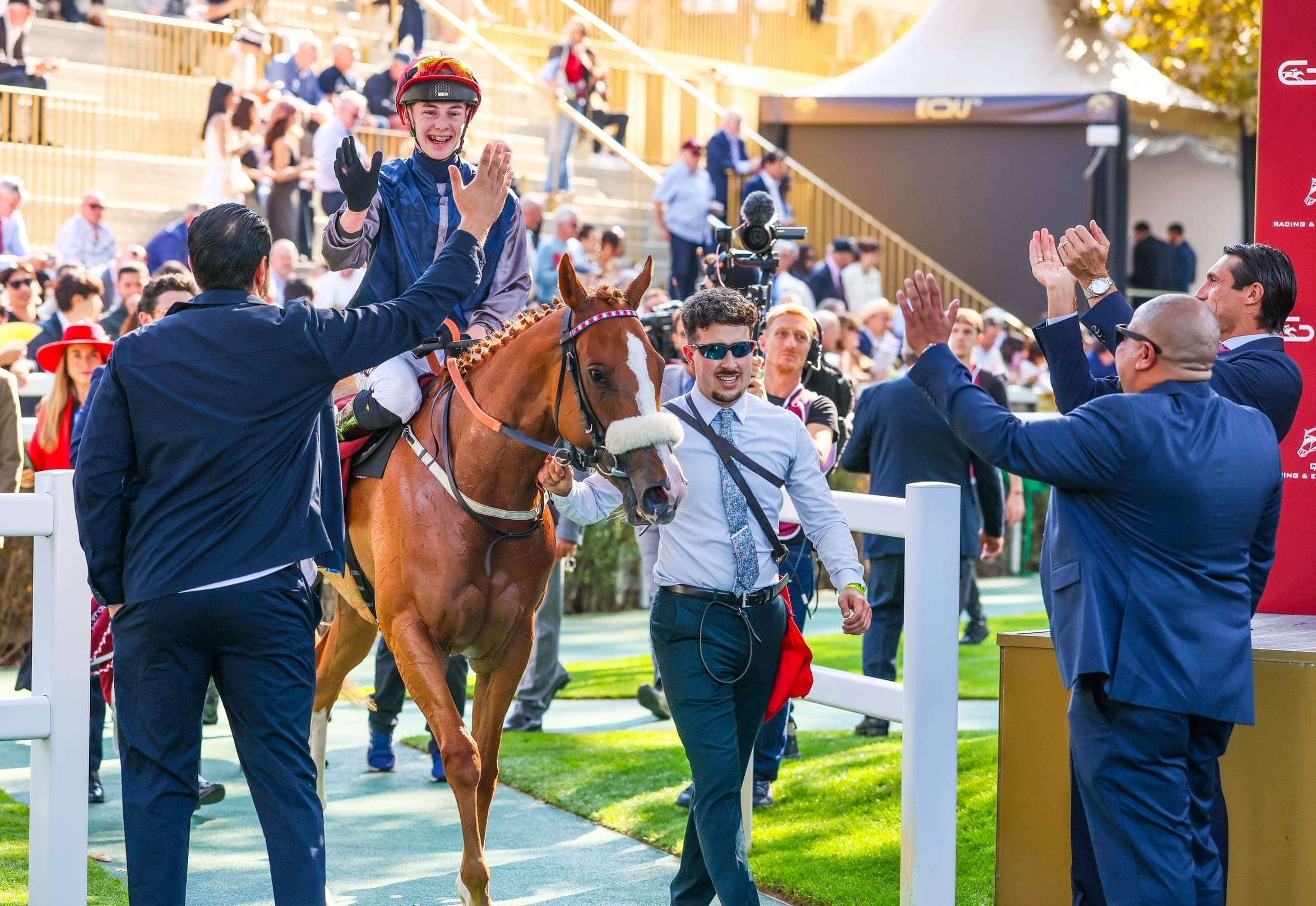 Miss Yechance and jockey Jack Nicholls return to the winner's enclosure as the team celebrates