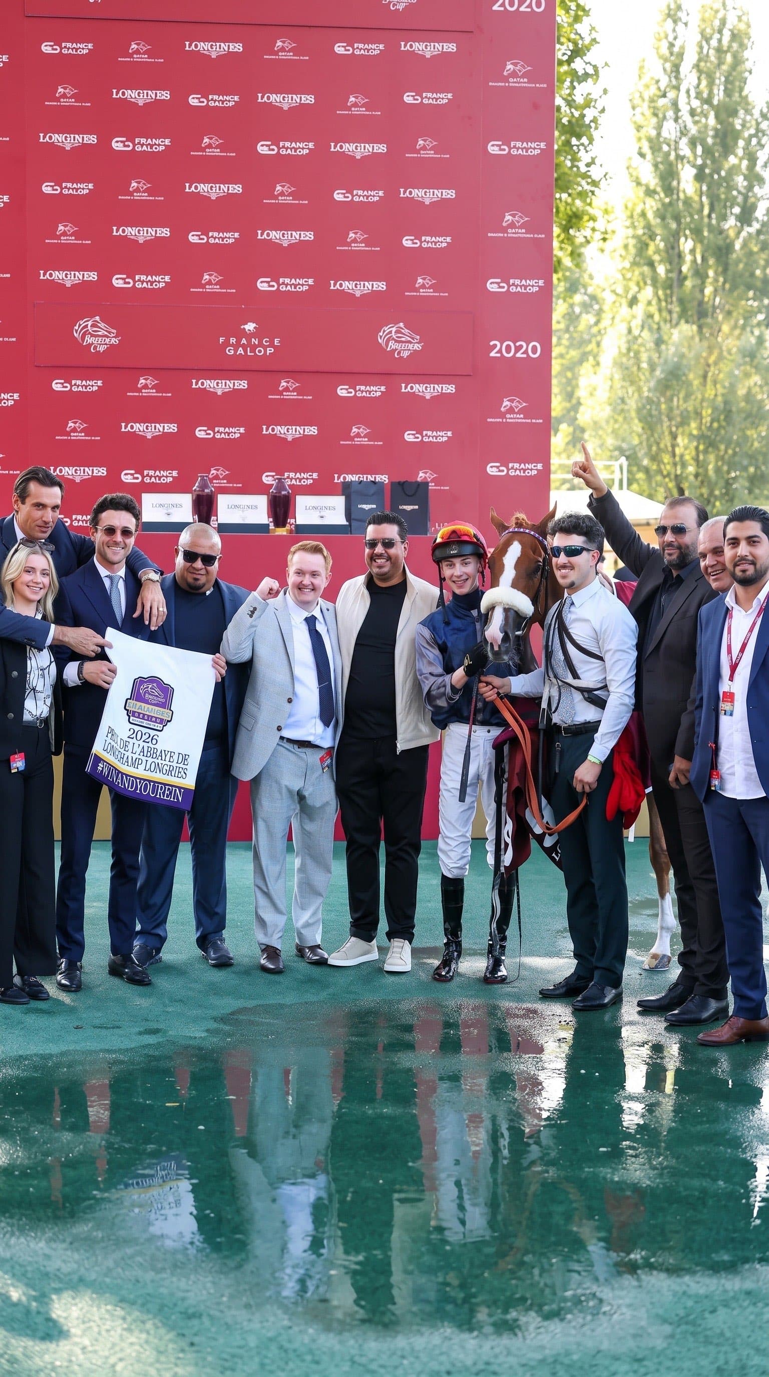 The jockey, the winning horse and the Al Leith Racing team celebrating in the winners' circle after the Prix de l'Abbaye de Longchamp 2026